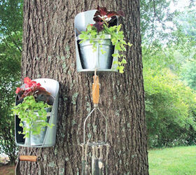repurposed junk garden, Feed grain scoops again with MWHP s idea of placing them on the tree with our favorite wind chimes we made from flattened spoons and vintage kitchen tools they sound so very pretty