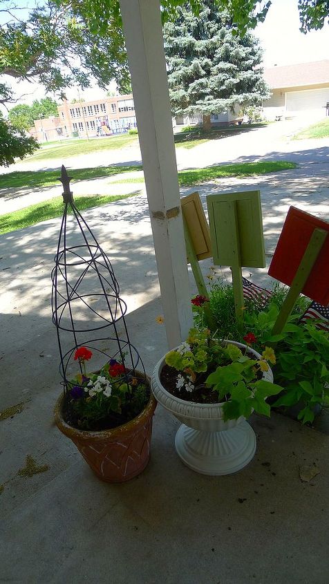 q porch in transition, diy, gardening, outdoor furniture, outdoor living, painted furniture, porches, Just a couple of pots planted this morning One of our local greenhouses had an all you can fit in a flat for 2 sale