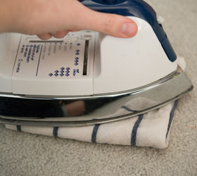 a chemical free way to get carpet stains out, cleaning tips, flooring, go green, Turn your iron on high heat and press it in to the towel The towel is pressing in to the stain using steam to release the stain up to the surface Repeat if necessary