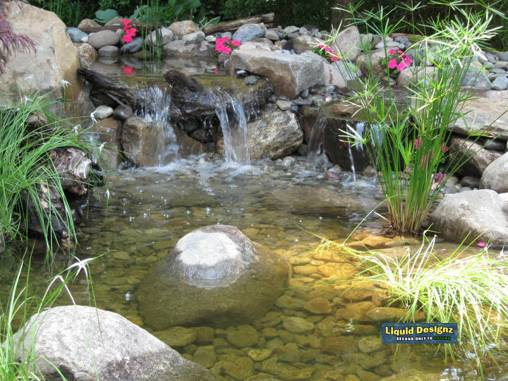 a couple of very cool and unique pondless waterfalls installed by liquid designz in, landscape, outdoor living, ponds water features, A bunch of impatiens go along way in this gorgeous design 4 of 4