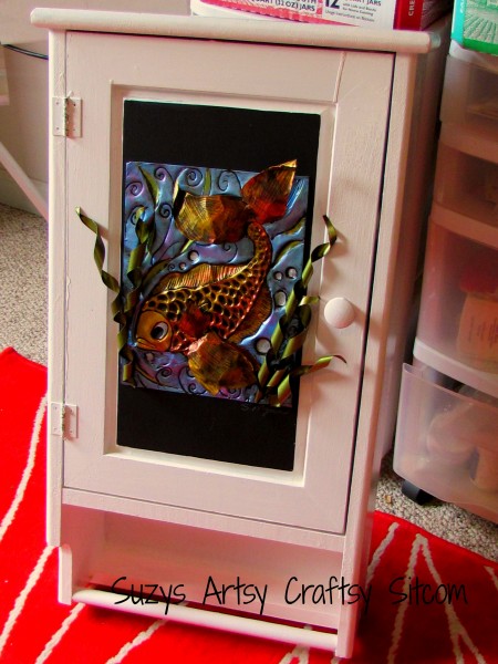 embossed fish cabinet, crafts, kitchen cabinets, Adding embossed aluminum art to a bathroom cabinet