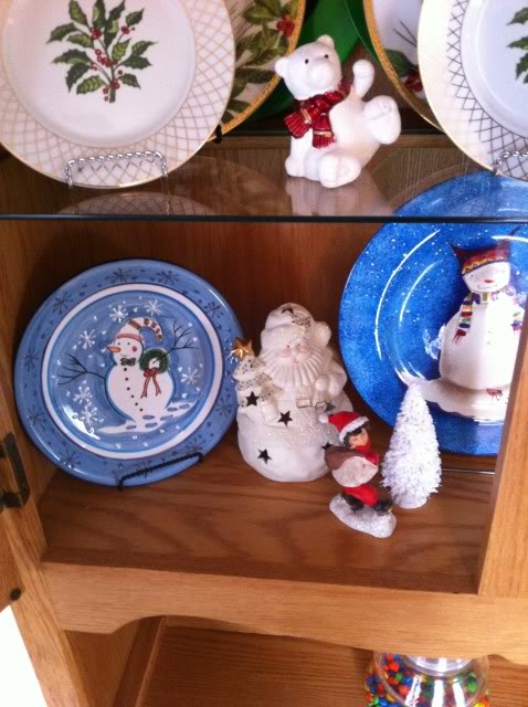 christmas china hutch decor, christmas decorations, seasonal holiday decor, On the lower shelf I used a pair of handpainted snowmen salad plates They were found at Goodwill and cost a total of 50 each