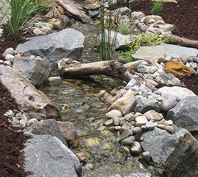 rainwater harvesting and self sustainable water feature, doors, go green, outdoor living, ponds water features, spas, A great shot of the meandering stream thanks to the variation in rock work along the way The excavation was perfectly straight prior to any of our precise rock placements
