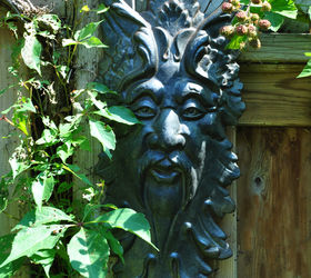 10 great ways to dress up a garden wall or fence, fences, gardening, landscape, outdoor living, 1 Layer a decorative garden ornament over vines