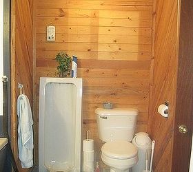 bathroom remodel, bathroom ideas, remodeling, Before Walls had been made from old pallets The toilet and yes that s a urinal were on a platform because of a plumbing issue
