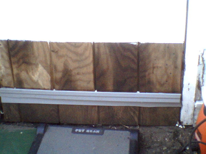refurbishing an old shed using a variety of low or no cost materials, home maintenance repairs, outdoor living, Thank fully the rickety shelf had 2 lenghts of the same wood panels which were used and left over vinyl corners left over from the new shed were cut to serve as protective edging on the bottom of the door