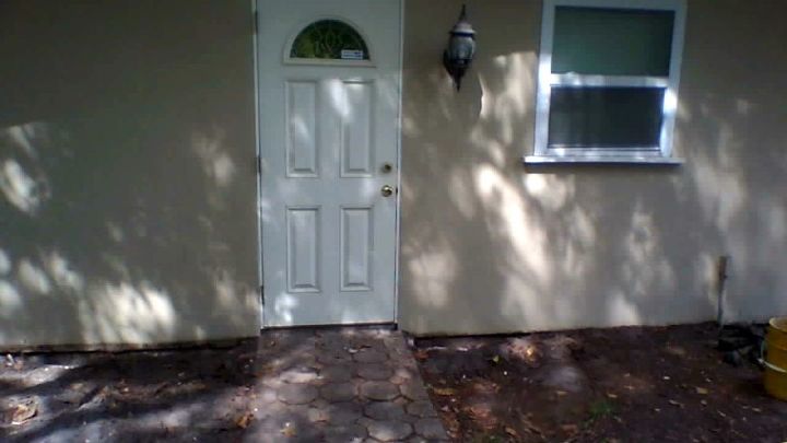 newly bought home has stucco walls that is taken below grade