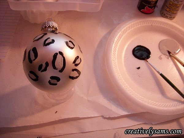 snow leopard ornaments tutorial, christmas decorations, crafts, seasonal holiday decor, Once the paint had dried I used the thin detail brush painted around the spots but I didn t connect the lines as you can see in the next picture I liked the lines with a little wiggle to it better that the smooth lines