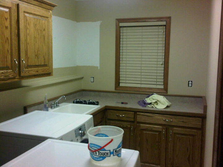 laundry room makeover, laundry rooms, In process We had to raise the cabinets for the new stands so EVERYTHING came down