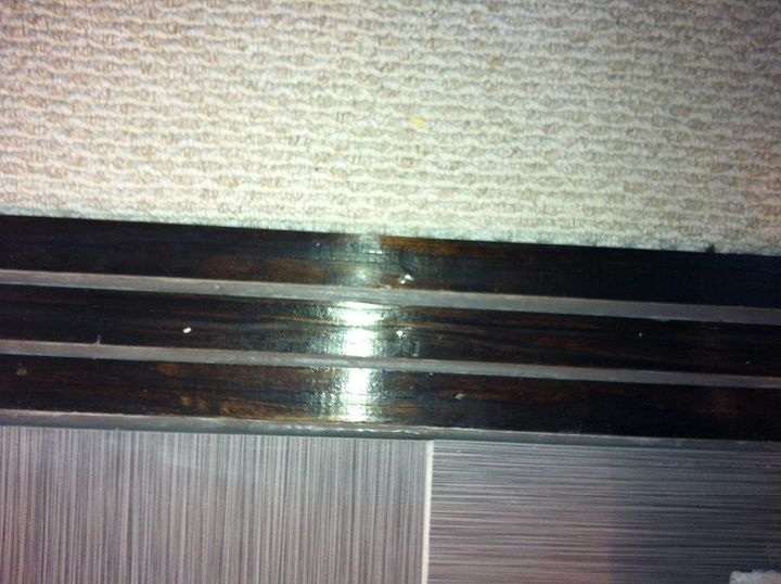 I am new in home talk, just open my account earlier today and I find this web site very cool. Just wanted to share my way of doing my own transition to save money. This is between carpet and tile. I bought 1 pcs of wood for 4 dollar, nail it down on the floor, stain it then put grouts on it. It really works..