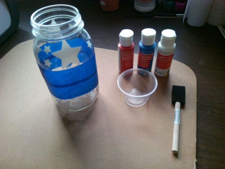 patriotic mason jar luminary, crafts, mason jars, patriotic decor ideas, seasonal holiday decor, I used a quart sized mason jar with star stickers and acrylic paints I used the tape to separate the 3 sections to paint Applied the stars around the area and then painted the jar
