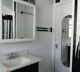 bathroom makeover, bathroom ideas, home decor, small bathroom ideas, After I painted the vanity black and the cabinets white The stripes ended at the top of the door