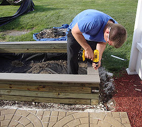 diy sandbox, Last addition Trex decking being screwed in through the top at all four corners