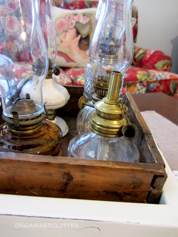 decorating with collections oil lamps, home decor, Small oil lamps in a vintage wooden box