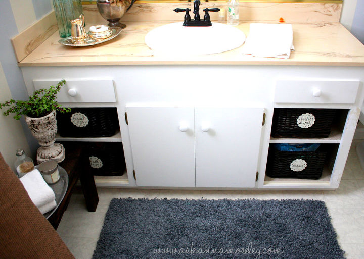bathroom makeover stripes amp inexpensive organization ideas, bathroom ideas, doors, home decor, organizing, Removing the cabinet doors and adding baskets gave the space more personality and gives it more of a custom look