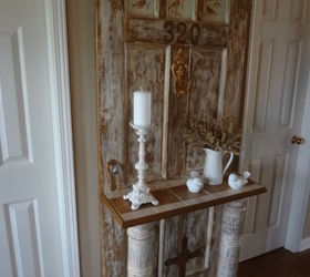 vintage door turned into hall tree for the entrance, home decor, repurposing upcycling, We used old posts from our front porch for the legs between the two shelves The unused part of the posts are going to made into lamps The posts are hollow inside so will be perfect to run wire thru