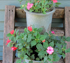 re purposed tree house ladder, container gardening, gardening, repurposing upcycling, Here are some impatiens planted in a metal minnow bucket and the bucket insert Holes were punched in the bottoms for drainage