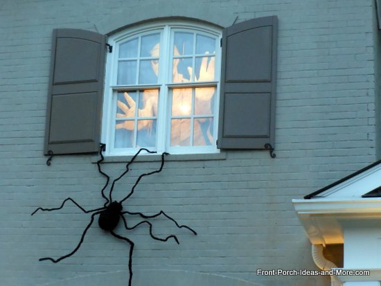 scary outdoor halloween decorations, halloween decorations, porches, seasonal holiday decor, A giant spider and a ghost in the window