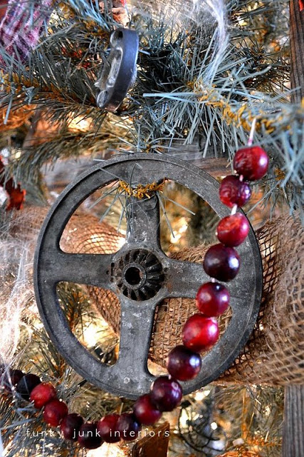 a unique stepladder christmas tree, christmas decorations, repurposing upcycling, seasonal holiday decor, I think this is a wash line wheel Or something As long as it s tarnished metal that works for me