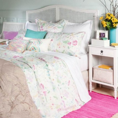 home decor floral accents done the right way, home decor, shabby chic, I love the neutral white in the majority of the room It makes the floral accents in pastels pop in a subtle way Then of course adding the yellow silk flowers and filler with the pink area rug really liven up this serene bedroom