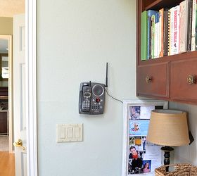 how to disguise ugly wall fixtures, home decor, wall decor, Why would the builder put the phone jack on one wall and the outlet for the answering machine on another