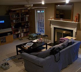 dark basement becomes a cozy family room, basement ideas, fireplaces mantels, home decor, Basement before
