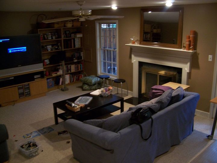 dark basement becomes a cozy family room, basement ideas, fireplaces mantels, home decor, Basement before