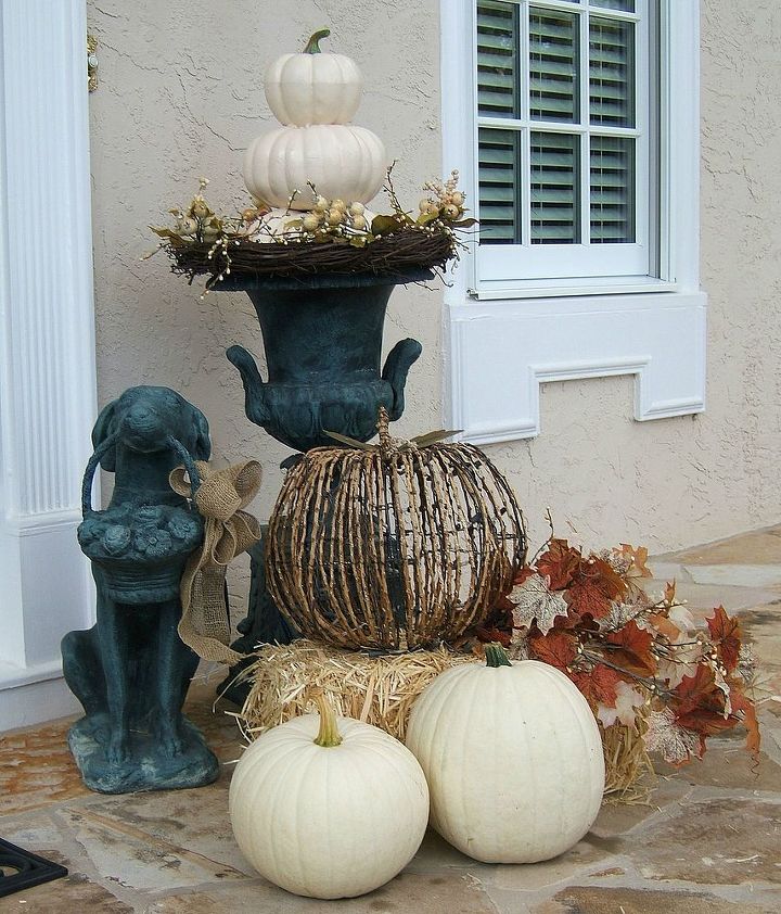 simple fall front porch, porches, seasonal holiday decor, Real white pumpkins were added to the lighted grapevine pumpkin I had a difficult time finding Ghost pumpkins this year