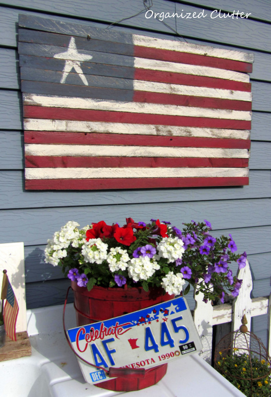 patriotic holiday junk on the potting bench, flowers, gardening, outdoor living, patriotic decor ideas, repurposing upcycling, seasonal holiday decor