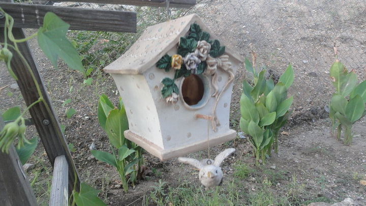 ladder shelves, gardening, repurposing upcycling, shelving ideas, i hung this ceramic bird house on the other side the little bird hangs by fishing line