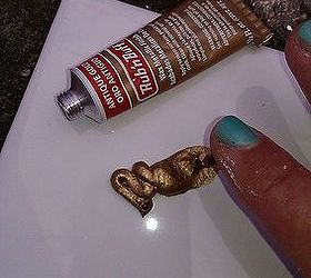add some midas touch to your decorating goldfinger your furniture, use some metallic rub n buff dab it on your finger