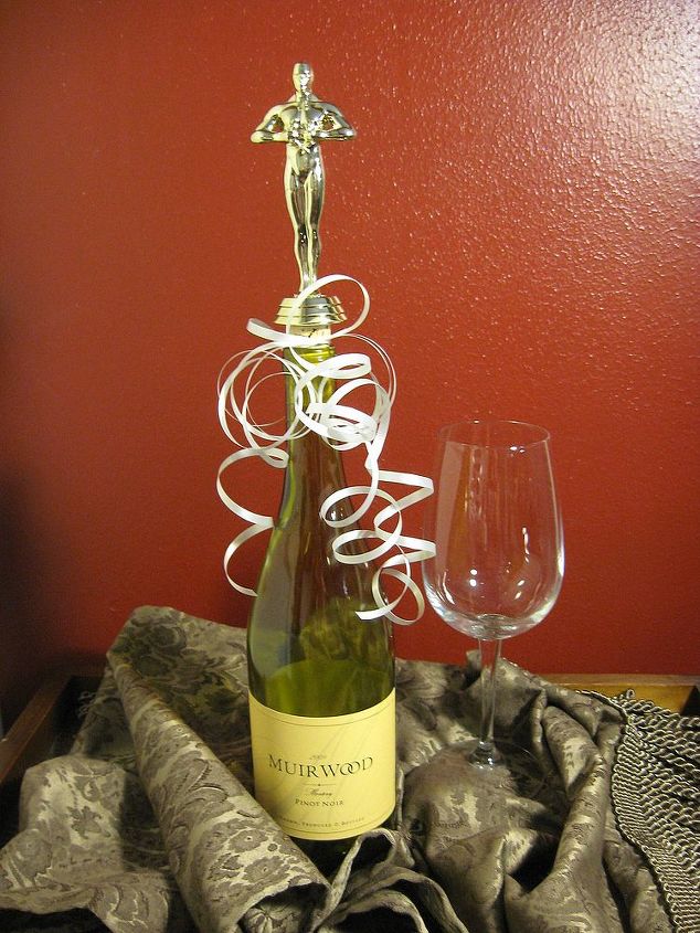 diy wine bottle stoppers out of old trophys, repurposing upcycling