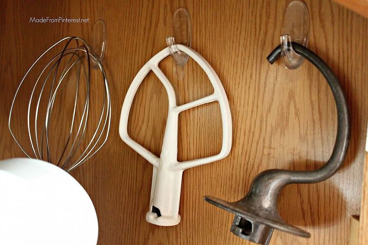 organize kitchen aid accessories with command hooks, kitchen design, organizing, Make sure to do this on an inside wall or it will swing every time you open or close the cupboard