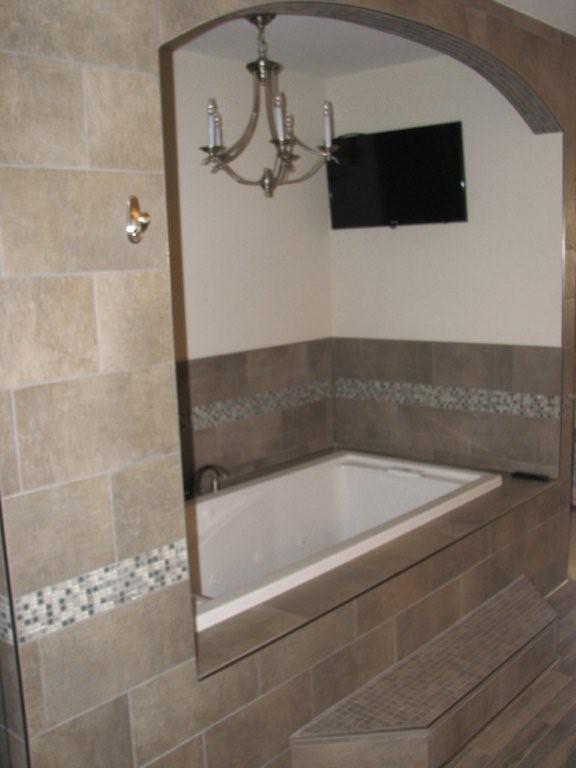 beautiful custom master bathroom remodel, bathroom ideas, home decor, home improvement, Jacuzzi Tub with chandelier lighting and mounted flat screen TV