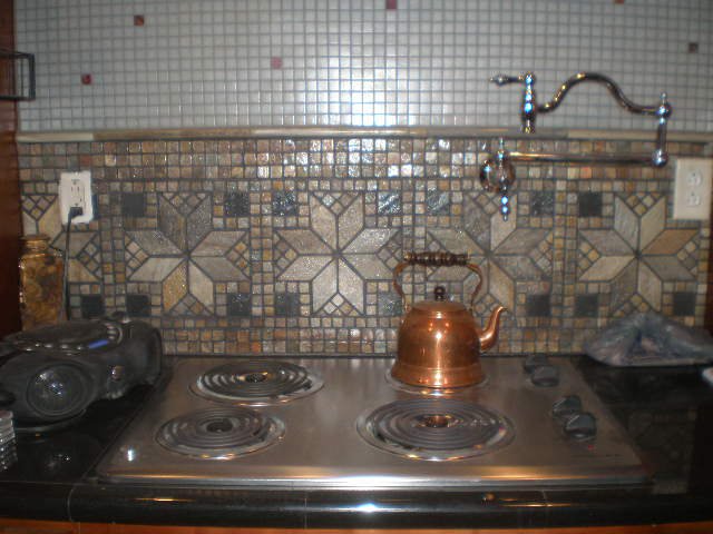 victorian remodel kitchen of my dreams sort of, home improvement, kitchen backsplash, kitchen design, tiling, Since I home can veggies and fruits I wanted a durable cooktop so I chose an updated old style that I can set heavy pots on and not worry The pot filler absolutely ROCKS Love the tile slate medallions below and glass tile above