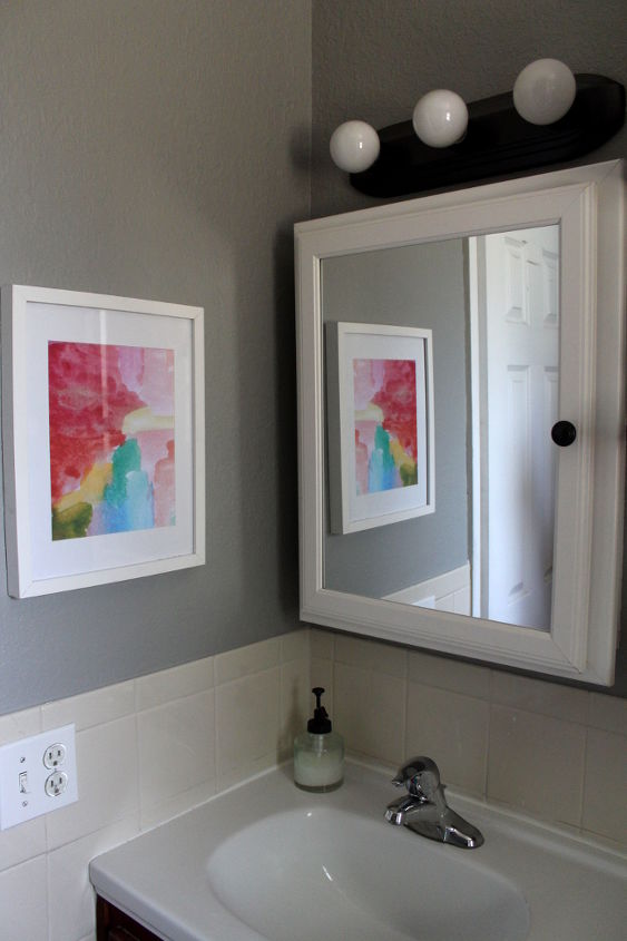70 bathroom makeover, bathroom ideas, home decor, repurposing upcycling, shelving ideas, small bathroom ideas, Add color to a neutral room by framing vibrant paintings This watercolor printable was free
