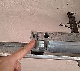 replace garage door rollers for less than 8, garage doors, garages, home maintenance repairs, Label where the old rollers are located on the bracket