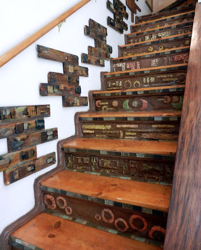 staircase project develops mind of it s own, concrete masonry, home decor, stairs, Staircase I hand formed all tiles from portland cement and carved with a dremel tool Risers combined with portland cement and nutmeg colored grout