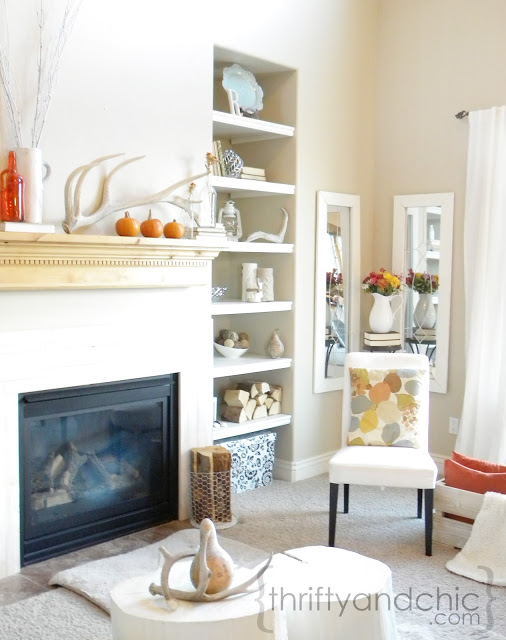 simple fall mantel and decorating for fall, living room ideas, seasonal holiday decor, Living room keeping the palette neutral and adding pops of orange accessories