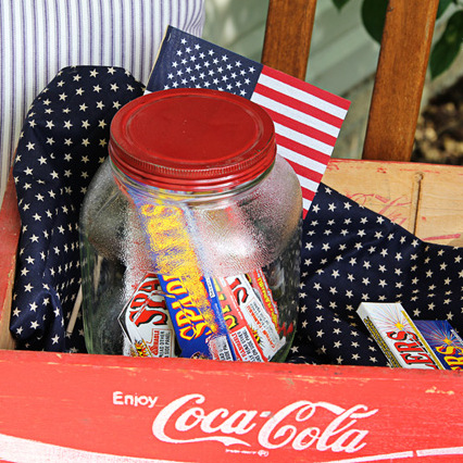 celebrating the red white and blue in style, outdoor living, patriotic decor ideas, seasonal holiday decor, You can never have too many sparklers I store them in a vintage jar in my Coke crate