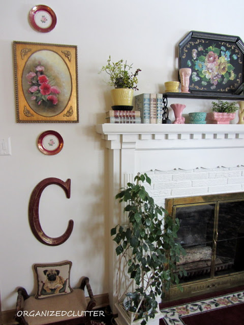 an organized clutter home tour, home decor, Living room mantel with vintage flower pots and vases