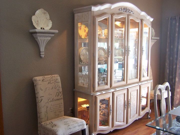 my dining room redo with reused furnishings, dining room ideas, home decor, repurposing upcycling, The hutch from Craig s list white washed with silver accents by a terrific artist also found on Craig s list