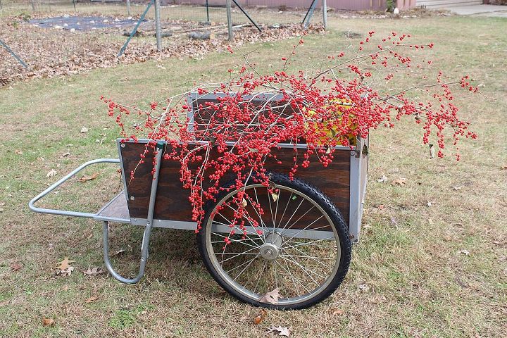 greens and winterberry holly d cor at the small house, gardening, seasonal holiday d cor, Nothing like a splash of red to cheer me up Winterberry Holly berries in the garden cart