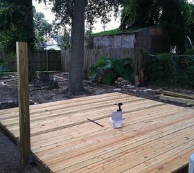 backyard deck in new orleans, Two 4x6 8 foot beams leveled and buried 2 feet deep Holes filled and secured with concrete posts connected to 4x6 posts with stainless steel cornet brackets