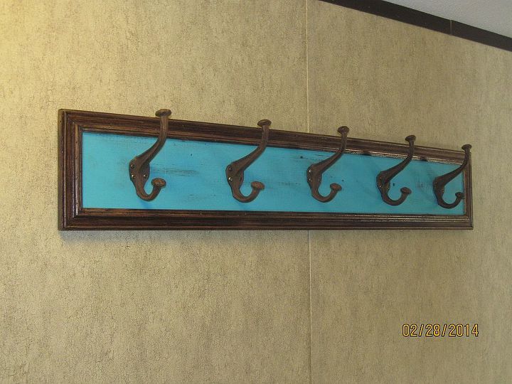 my first attempt at refinishing old furniture, painted furniture, Coat rack is made from a 1x6 cedar picket stained painted distress and poly Framed with stained leftover trim Added oversized hooks found at discount store for 10