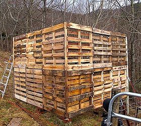 making a pallet barn, diy, pallet, repurposing upcycling, woodworking projects, The 2 stories of pallets are secured using the corner posts and recycled wood from around our homestead