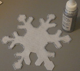 snowflake tree skirt diy, crafts, seasonal holiday decor, Each snowflake is handcut and outlined with glitter glue