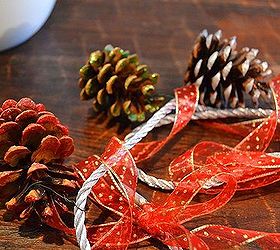 simple scented dazzling pine cone garland, crafts, seasonal holiday decor, After you ve attached the pine cones in the places of your choosing you can then add additional ribbon to dress things up