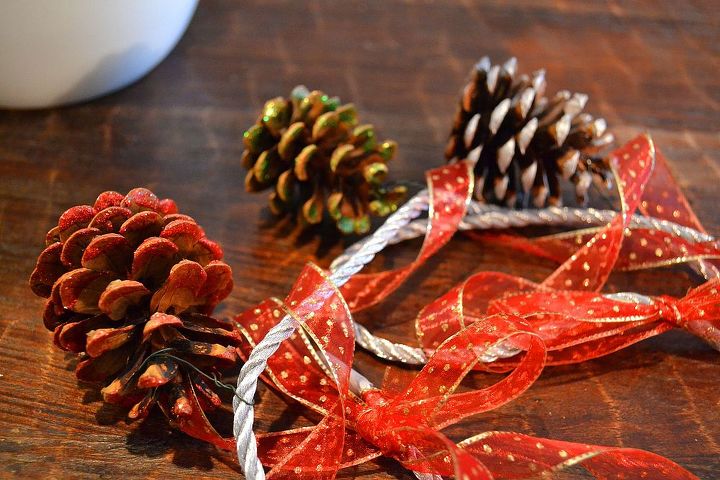 simple scented dazzling pine cone garland, crafts, seasonal holiday decor, After you ve attached the pine cones in the places of your choosing you can then add additional ribbon to dress things up