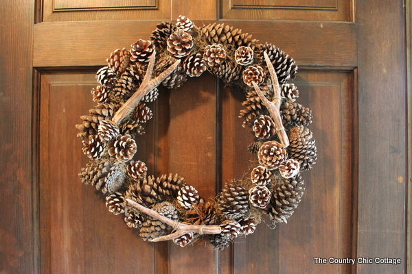 pottery barn faux antler wreath, crafts, seasonal holiday decor, wreaths, The completed wreath with the faux antlers and pinecones